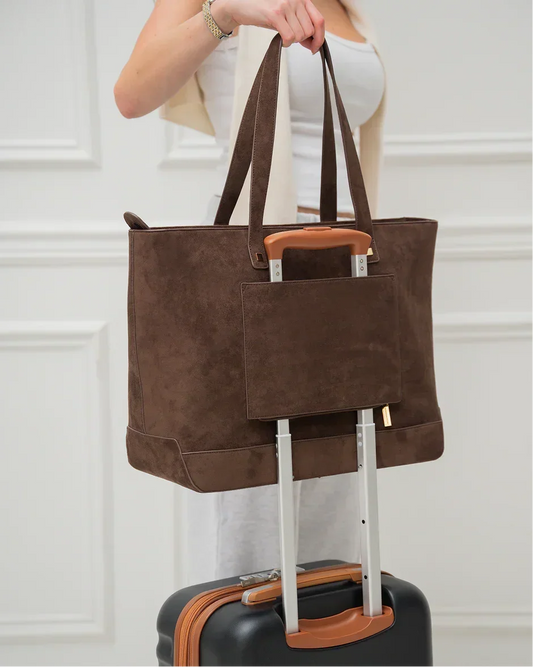 Brown vegan leather tote bag with luggage sleeve, perfect for travel and work
