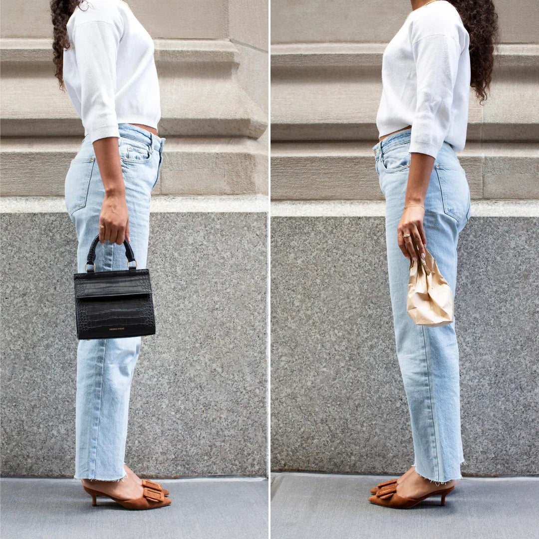 Woman in casual outfit holding black vegan leather lunch tote and brown paper bag side by side