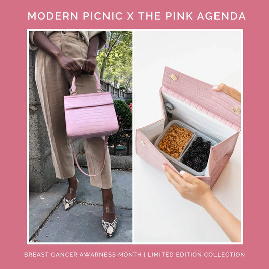 Limited edition pink vegan leather insulated lunch bag, carried by hand and shown holding food containers.