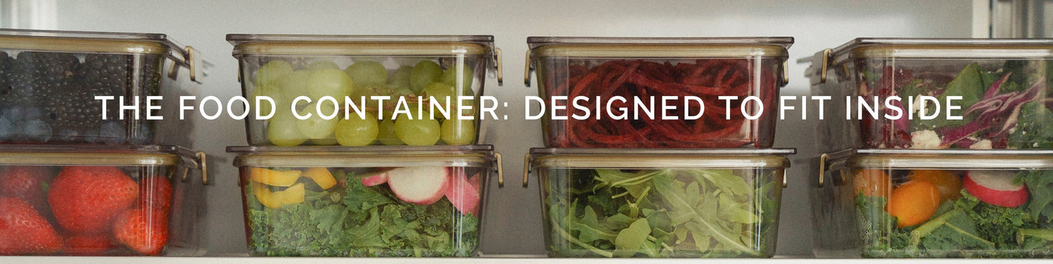 Stacked clear food containers with fresh fruits and vegetables on a refrigerator shelf