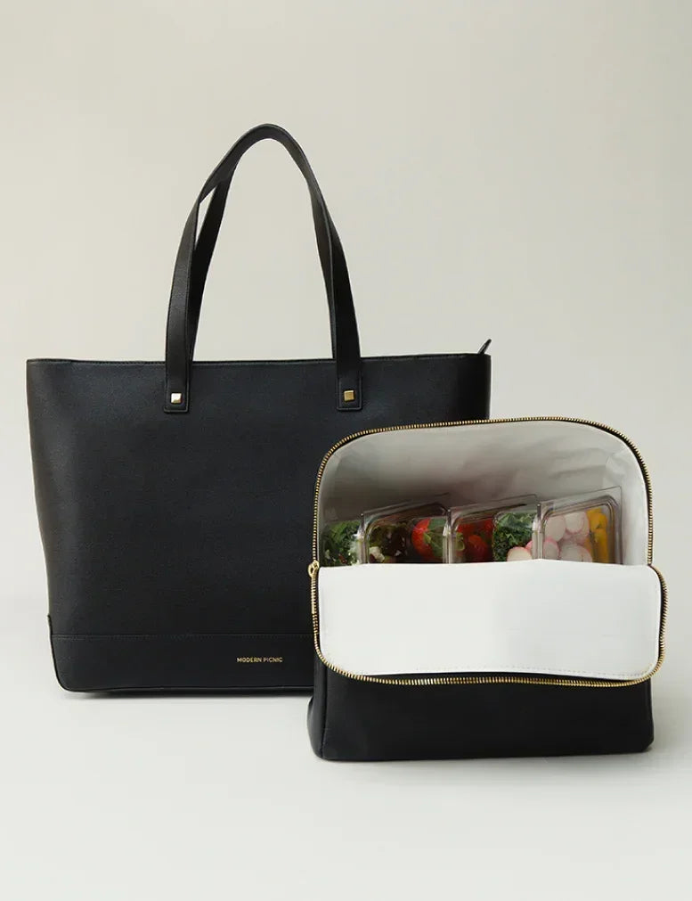 Black vegan leather tote with insulated lunch bag holding fresh food containers, perfect for work or travel