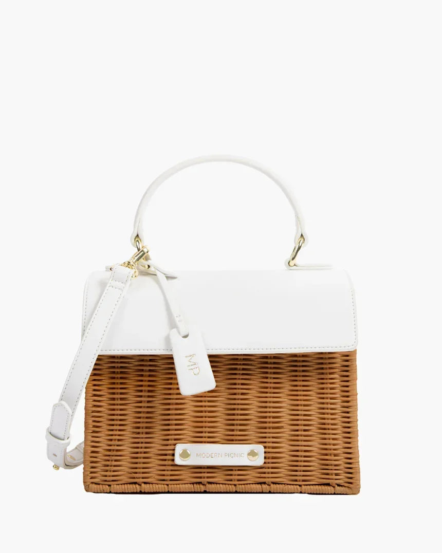 Chic insulated lunch bag with white vegan leather top and wicker-style body, gold hardware