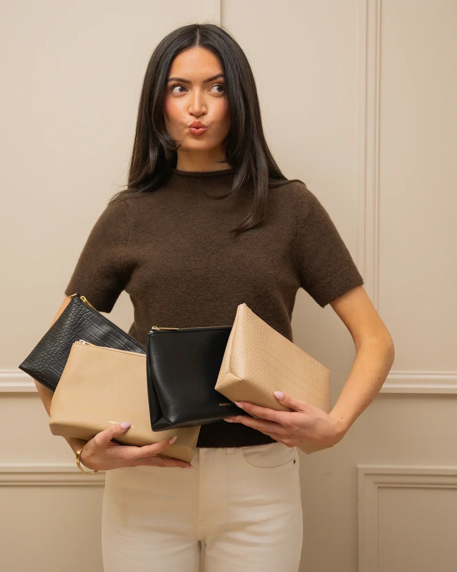Stylish vegan leather pouches in black and beige, perfect for everyday use and travel.