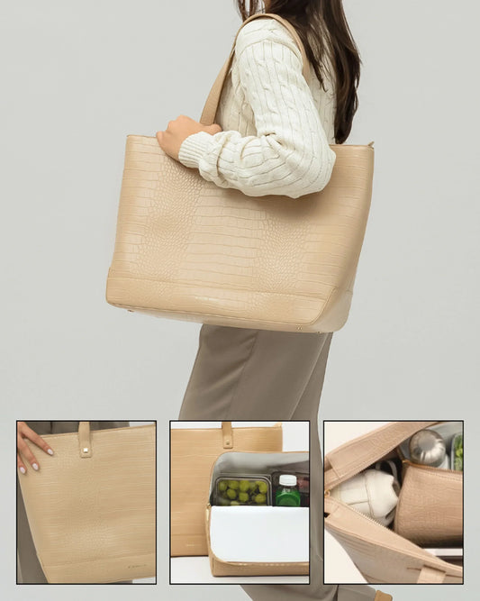 Beige vegan leather insulated tote bag with crocodile texture, shown carrying lunch items and worn by a woman in business attire.