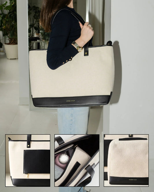 Woman carrying large insulated canvas and black vegan leather tote bag with organized compartments