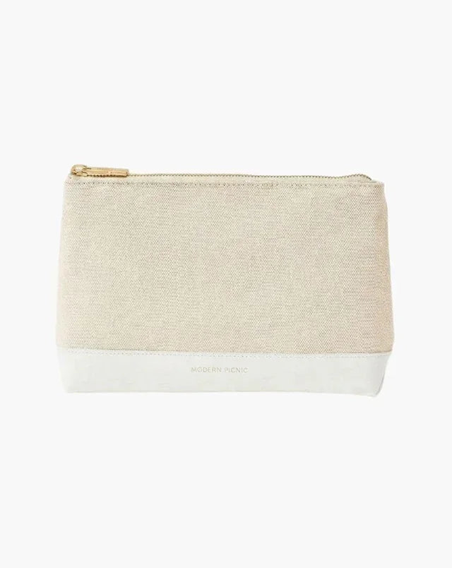 Beige canvas pouch with white vegan leather base and gold zipper, minimalist design for everyday use