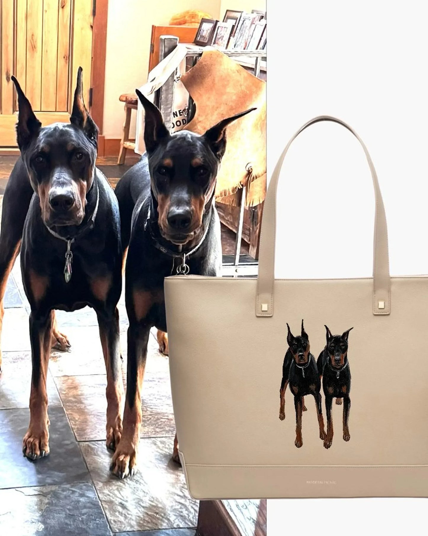 Beige vegan leather tote with embroidered Doberman dogs, shown next to real Dobermans indoors