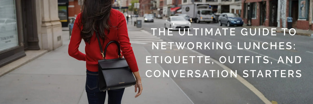 Woman in a red blazer carrying a black vegan leather insulated lunch bag on a city street.