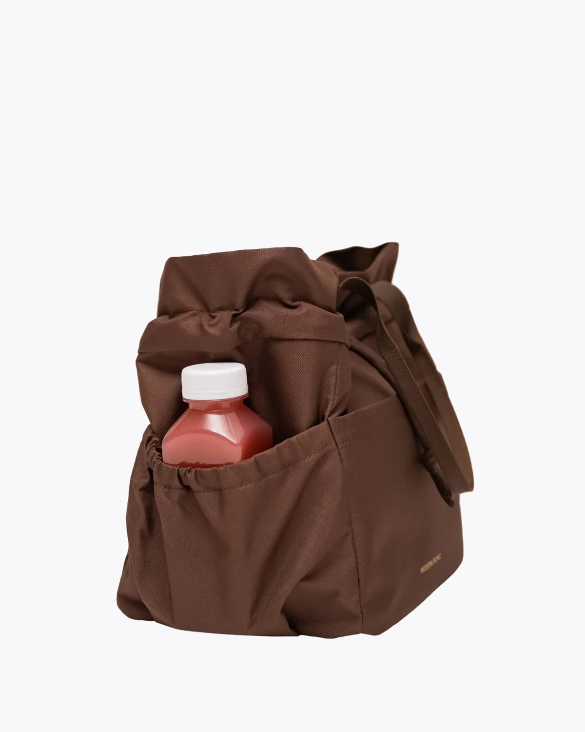 Brown insulated lunch bag with a small juice bottle tucked into the side pocket.