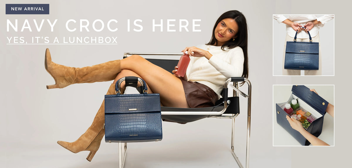 Woman relaxing with a navy croc vegan leather insulated lunch bag and water bottle.