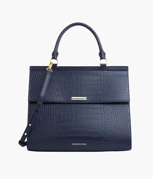 Navy blue croc-embossed vegan leather tote bag with gold hardware and shoulder strap