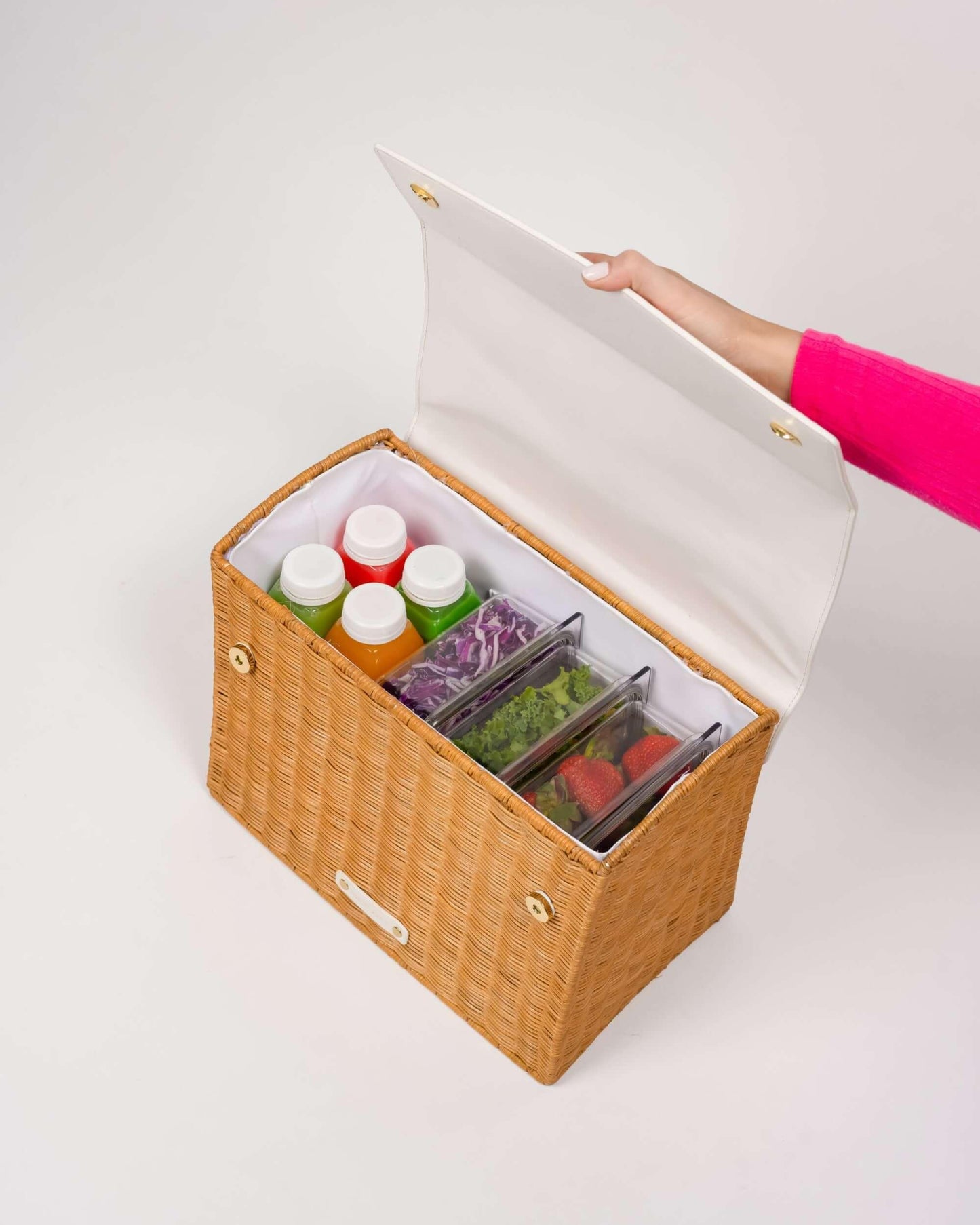 Woven insulated lunch tote with colorful juices and fresh food containers, perfect for healthy meals on the go.