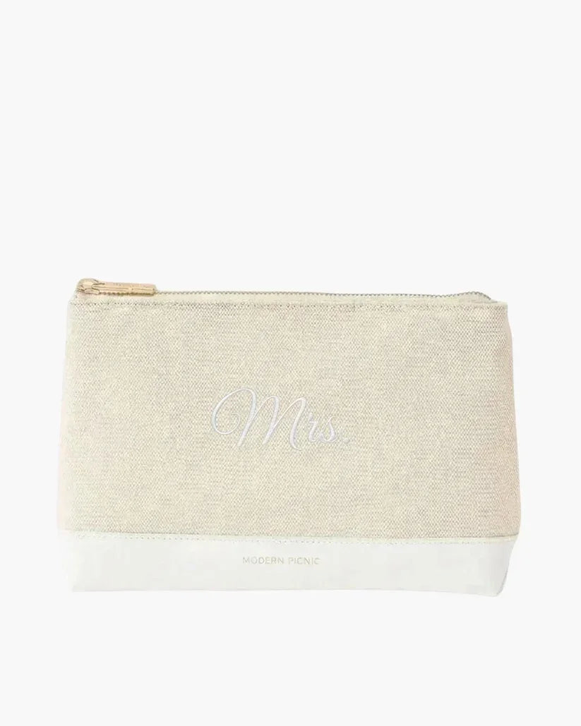 Cream textured canvas makeup bag with 'Mrs' in silver script and white base.