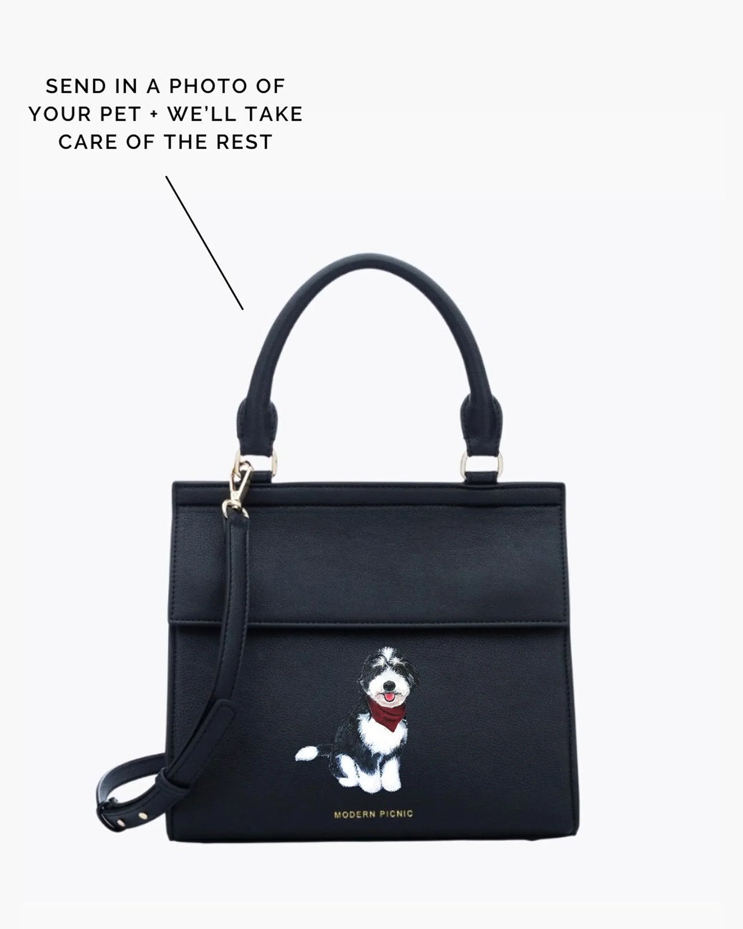 Black insulated lunch bag with custom pet illustration, top handle and crossbody strap.