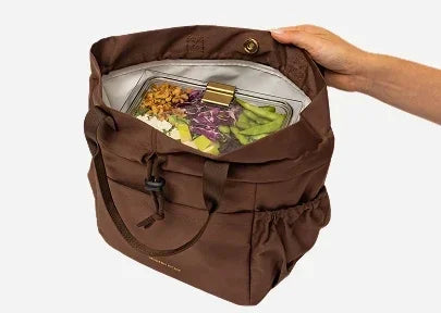 Brown insulated lunch tote bag containing a healthy salad in a glass container.