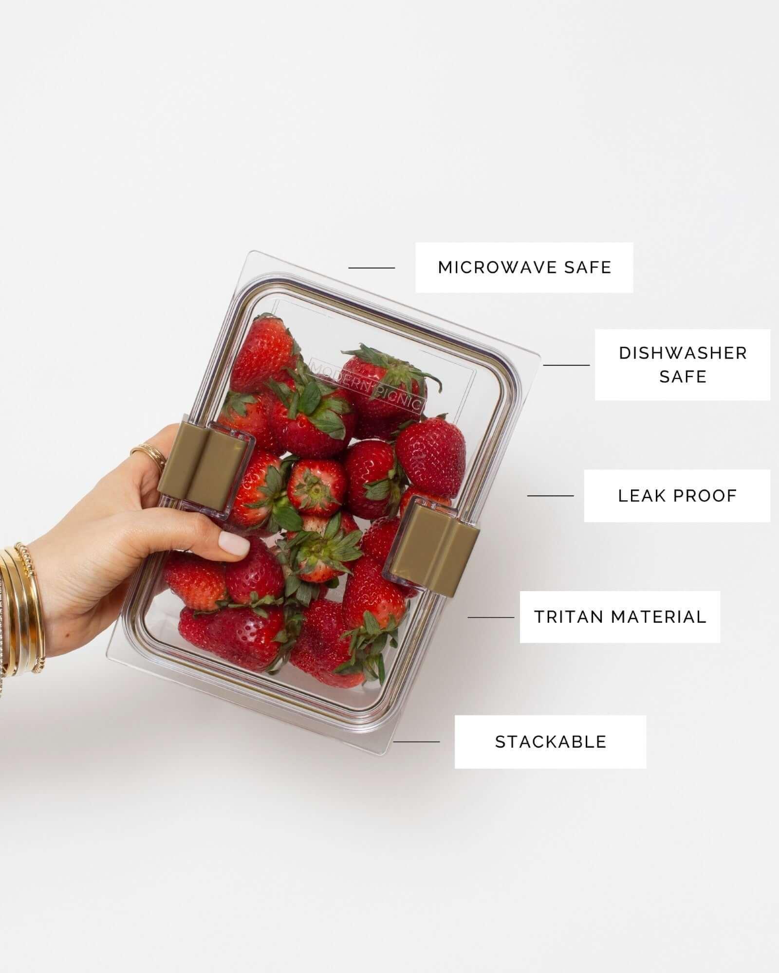 Close-up of reusable leak-proof food container labeled microwave safe and dishwasher safe
